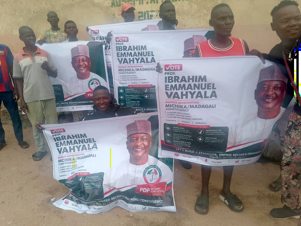 Youth group holding campaign posters